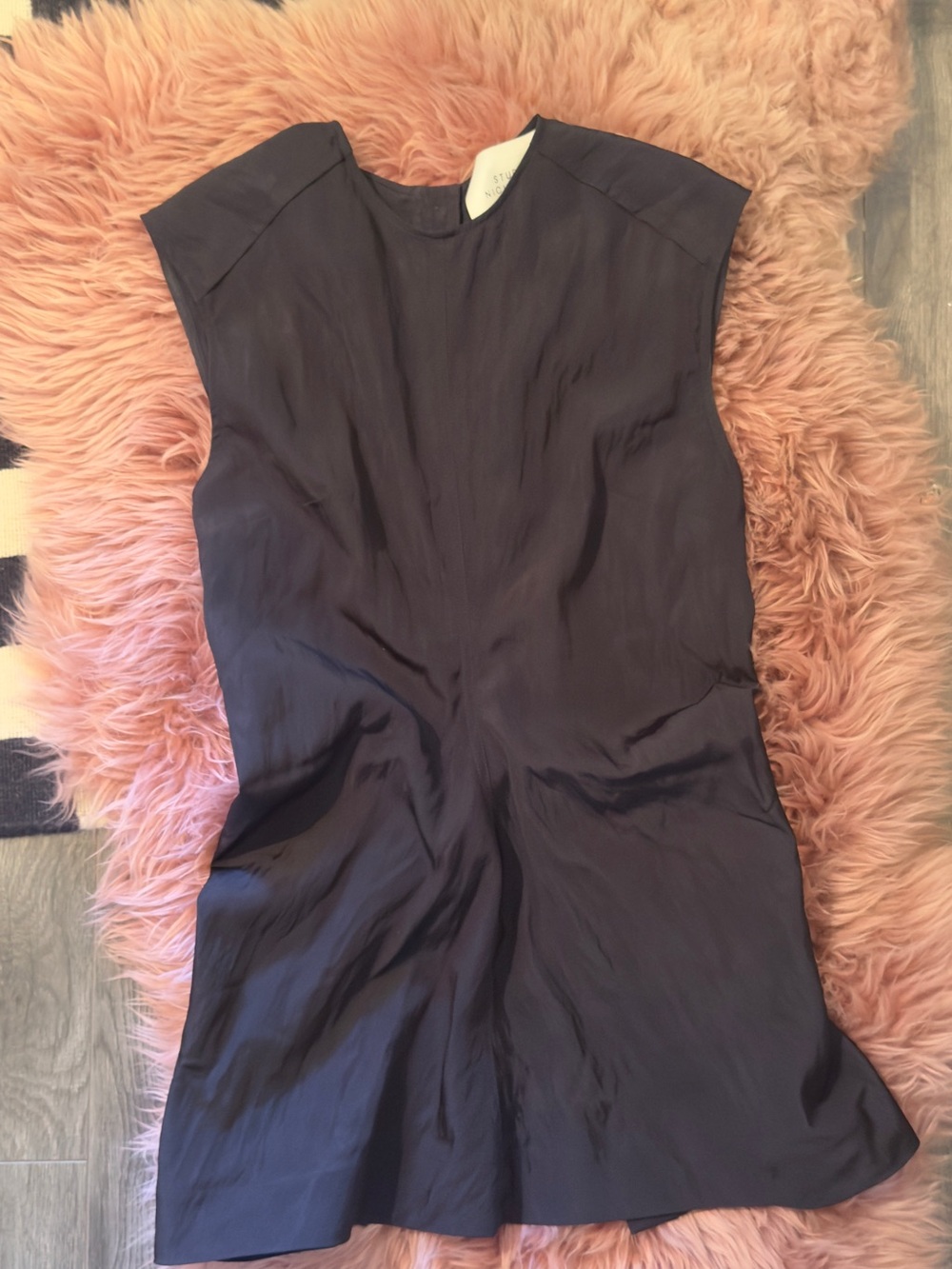 Sleek Black Sleeveless shift top with button closure back